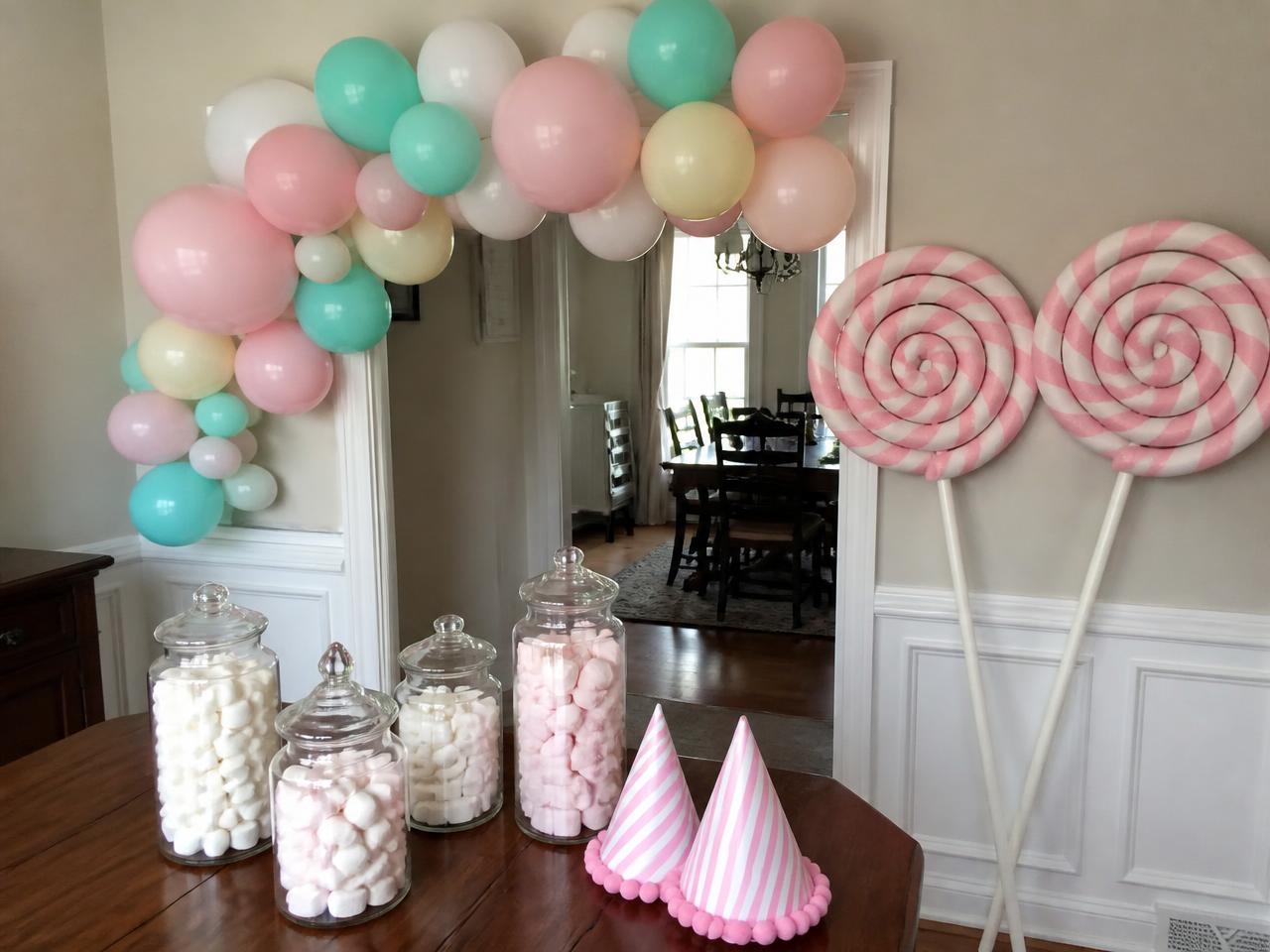 Paper lollipops, candy jars and cone hats.