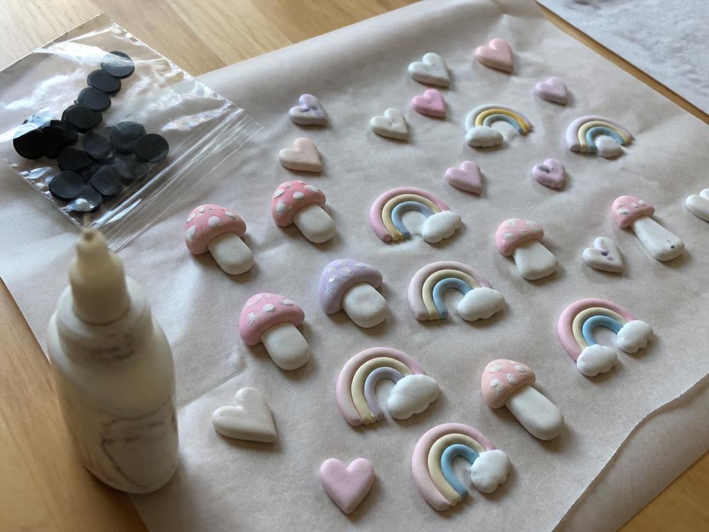 A whole tray of little clay shapes drying before the magnets go on