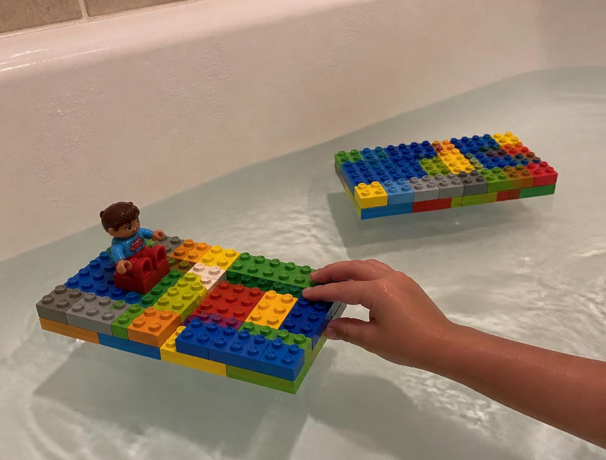 A flat brick raft with one passenger — how many before it tips?