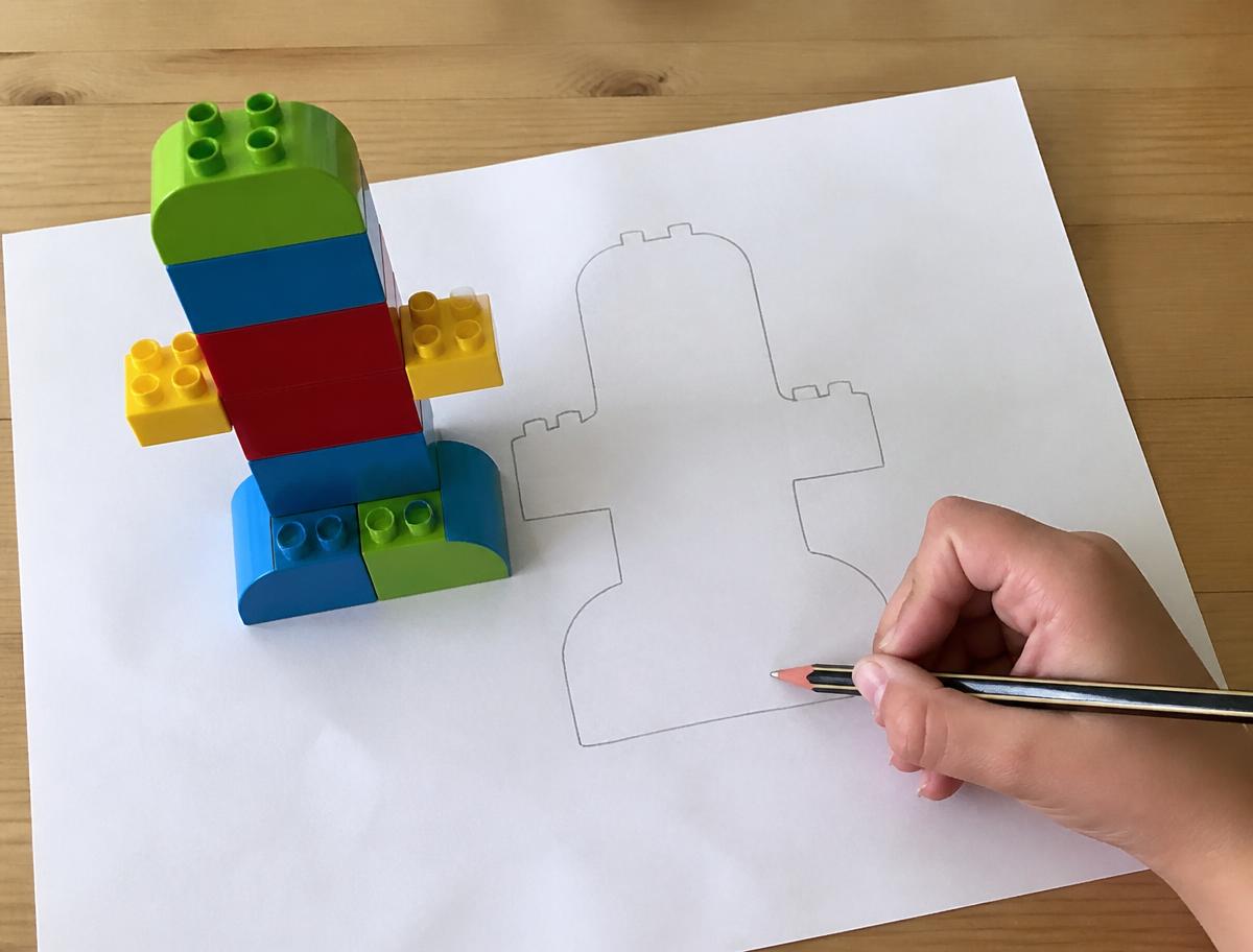 Trace around the build, lift it off, and the outline becomes tomorrow's challenge.