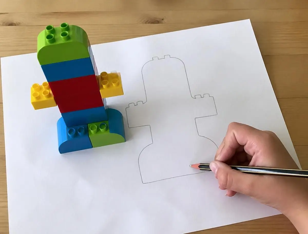 Trace around the build, lift it off, and the outline becomes tomorrow's challenge.