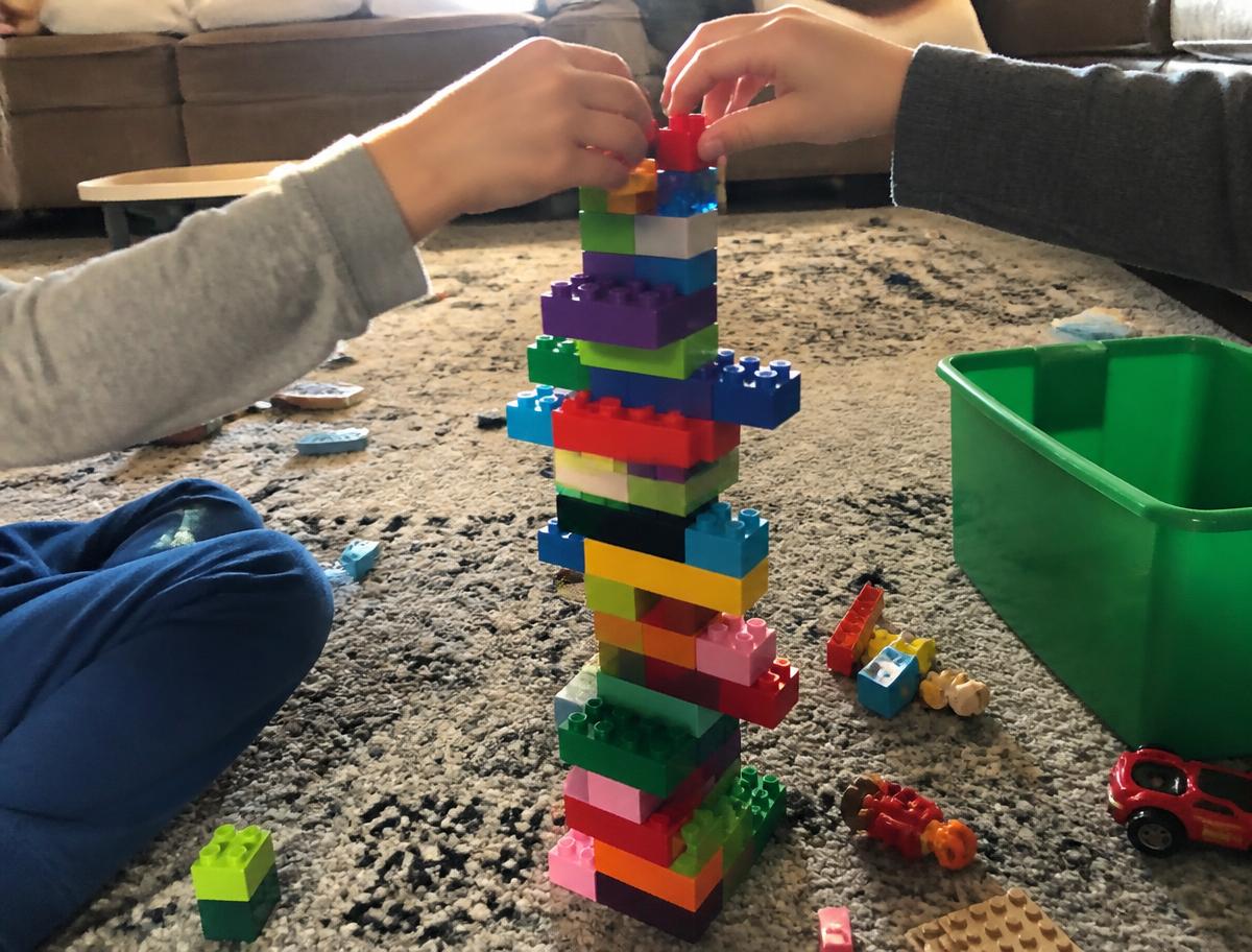 One brick each, in turns — whoever topples it loses the round.