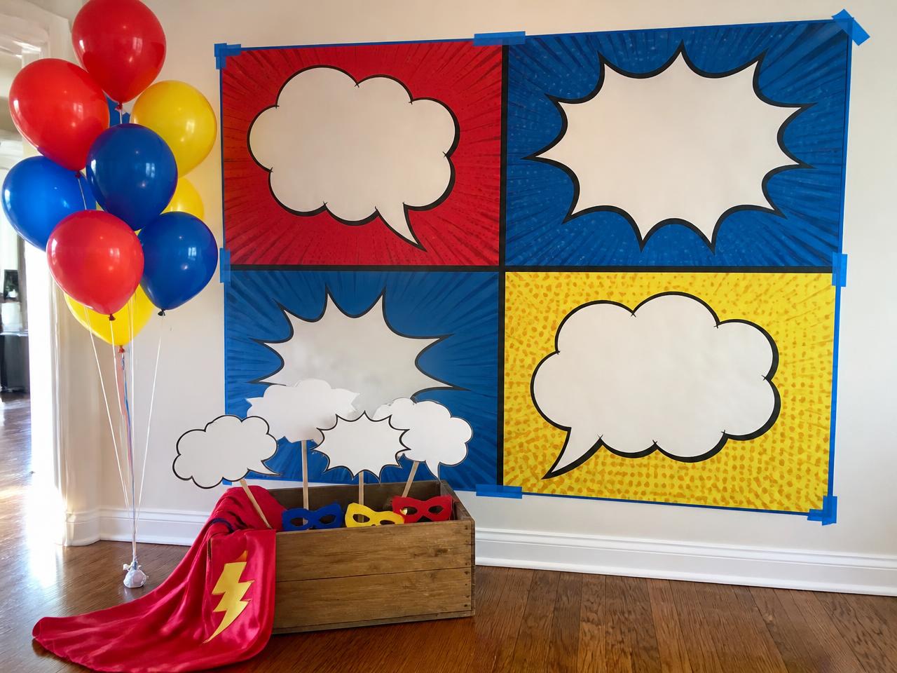 A printed backdrop and a crate of props.