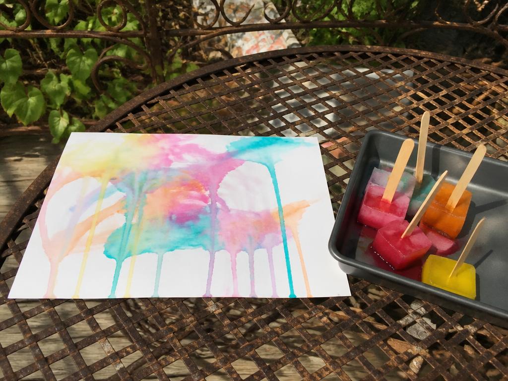 The finished painting drying outside, cubes still melting in the tray