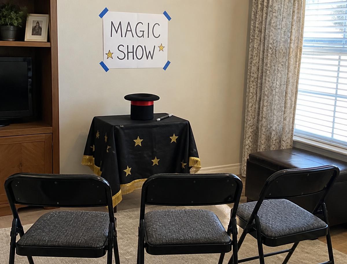 A draped side table, a sign and three chairs: a theatre.