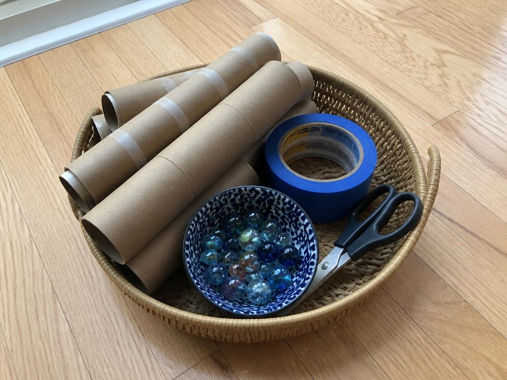 The whole kit: saved tubes, painter's tape, scissors and marbles.