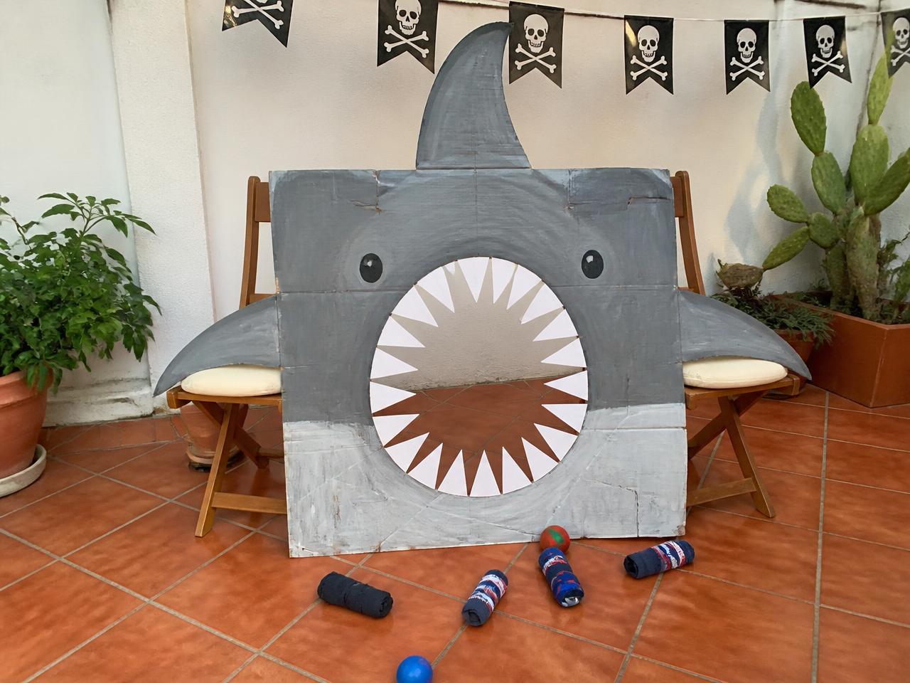 One flattened box, grey paint and paper teeth.