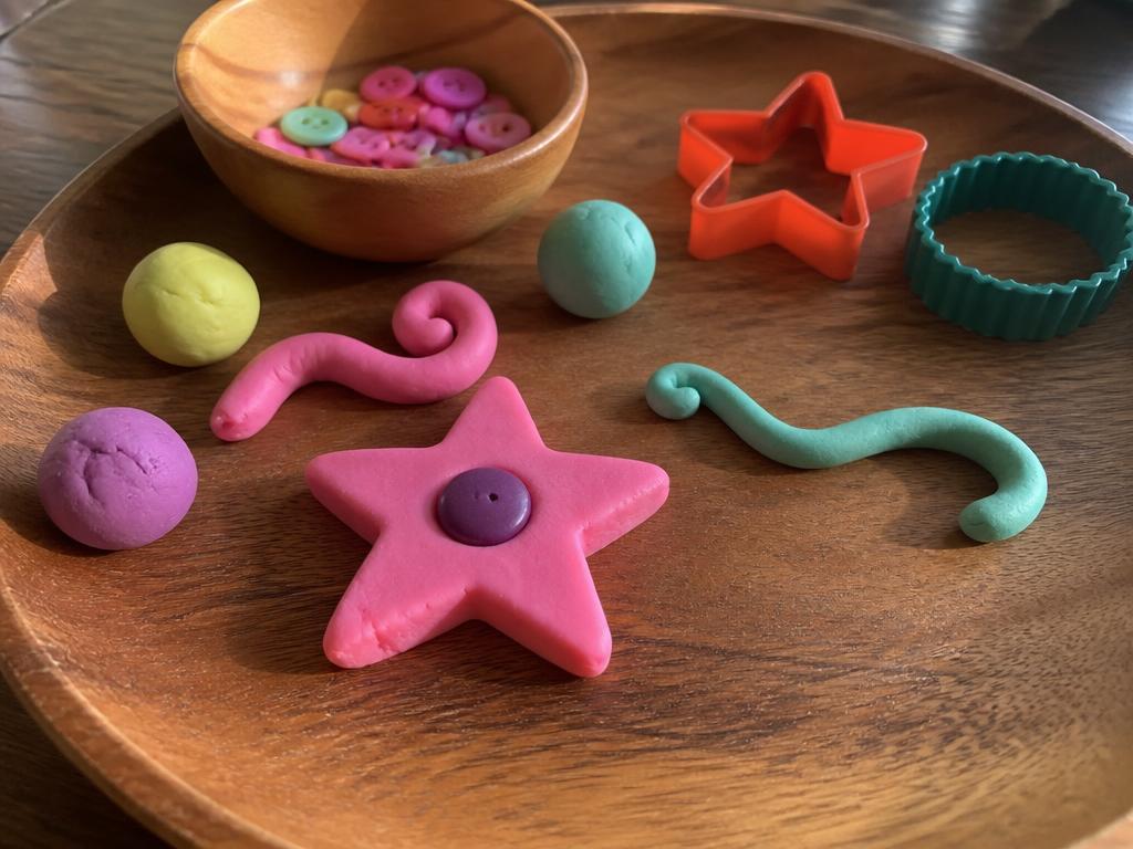 The finished pink star with its purple button, and all the leftover dough