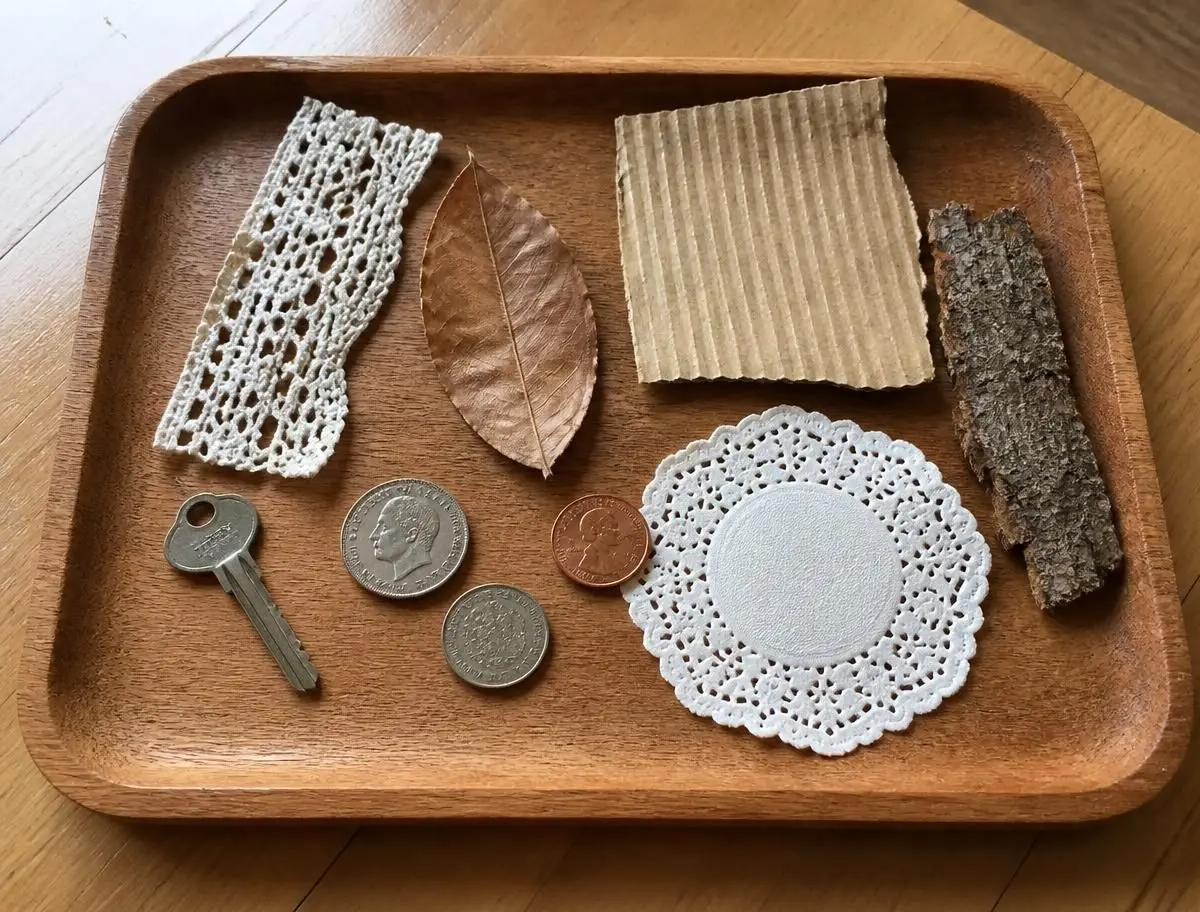 A basket of rubbing-worthy things gathered from around the house.