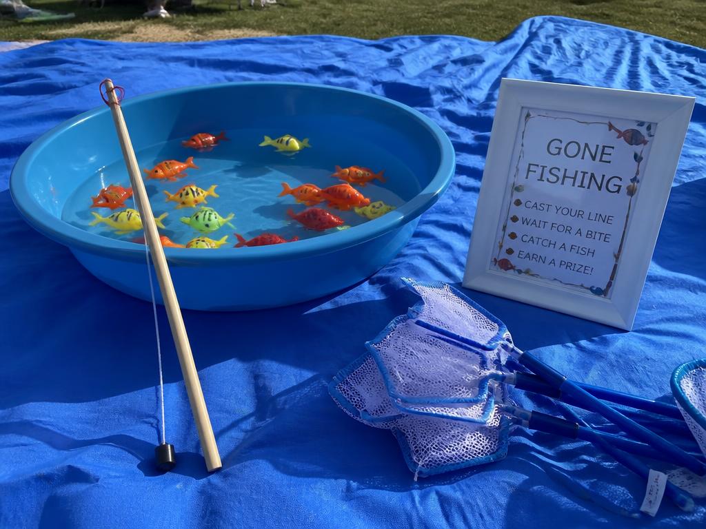 Nets, a magnet rod and a tub of floating fish — the station children return to all afternoon.