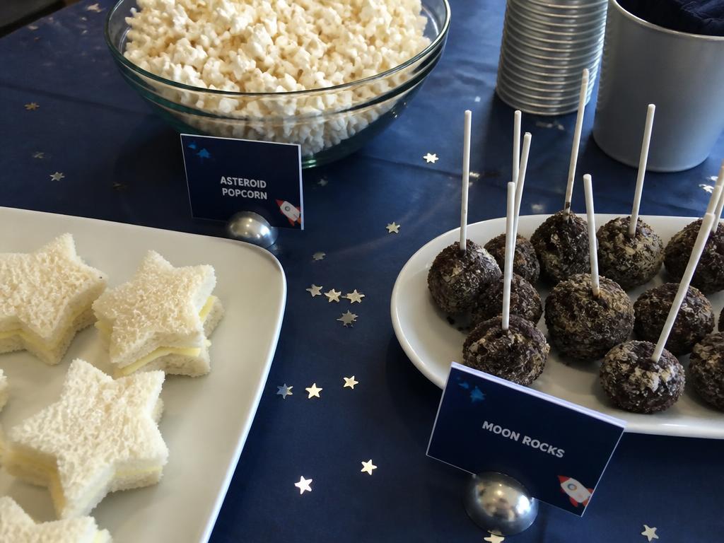 Star sandwiches, asteroid popcorn and moon rocks on sticks.