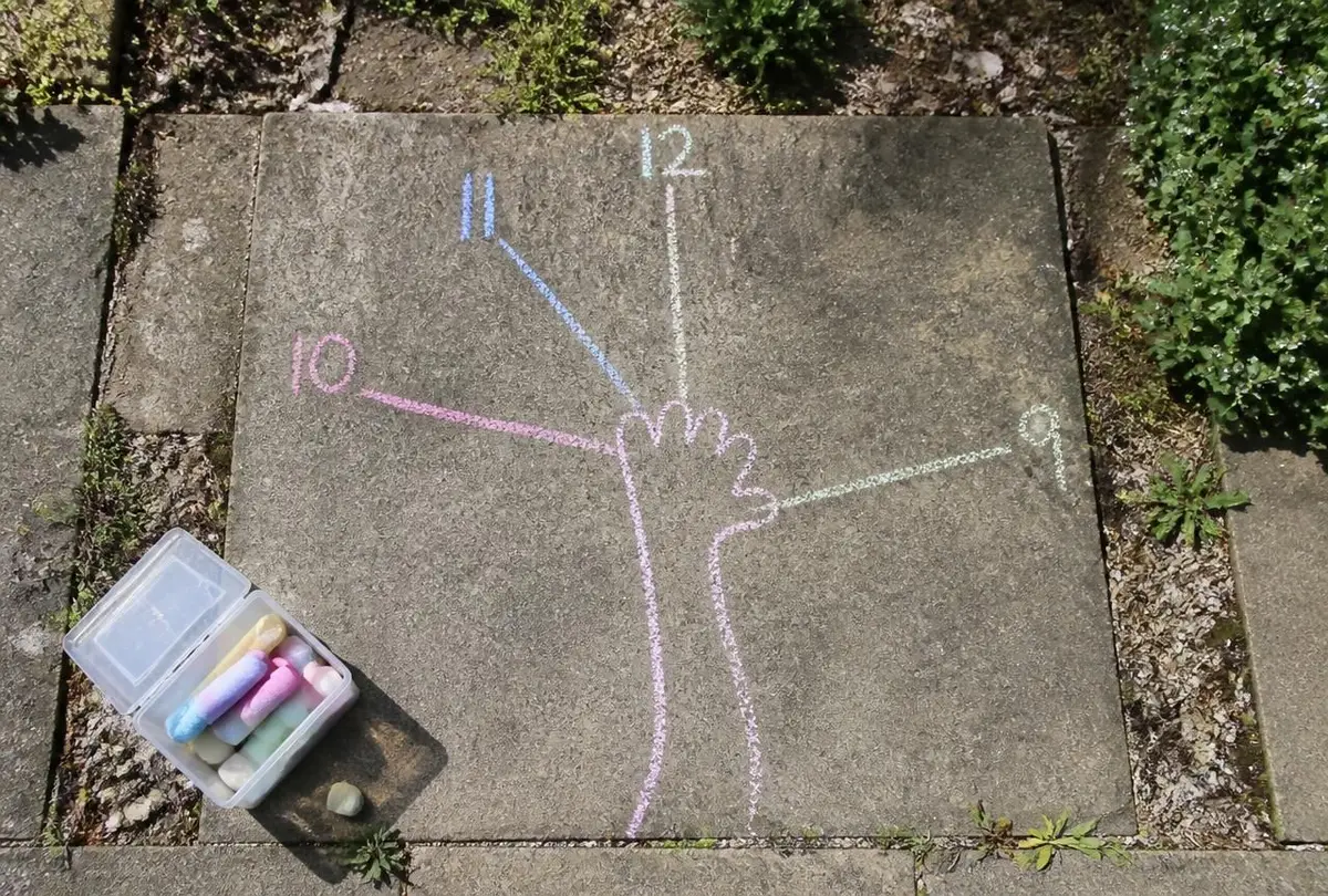 Chalk lines fanning out across the patio, one for every hour.