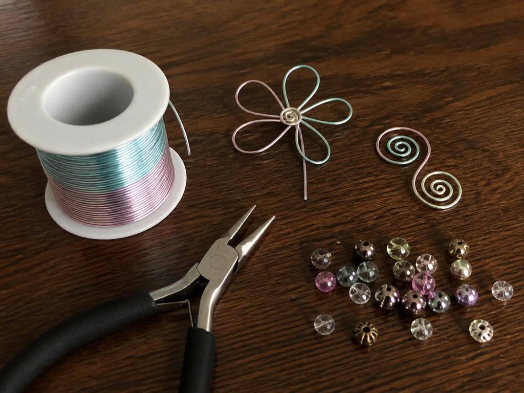Soft craft wire, pliers, beads and the first finished flower